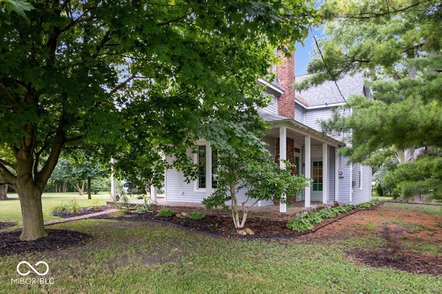 3160 S 50 E, Lebanon, IN 46052 - view of side of home featuring a chimney and a porch