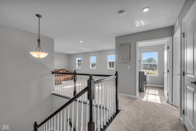 19174 Foley Dr, Westfield, IN 46074 - corridor with an upstairs landing, washing machine and dryer, light colored carpet, and recessed lighting