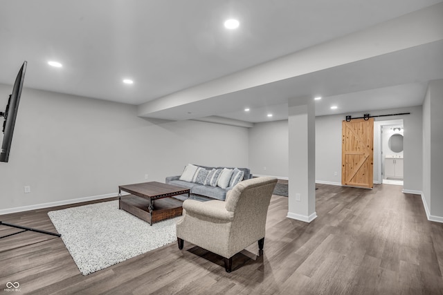 19174 Foley Dr, Westfield, IN 46074 - living room featuring wood finished floors, a barn door, and recessed lighting