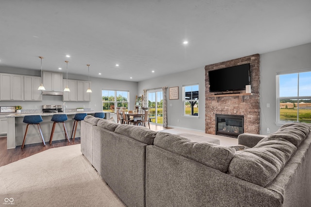 19174 Foley Dr, Westfield, IN 46074 - living area featuring wood finished floors, recessed lighting, and a fireplace