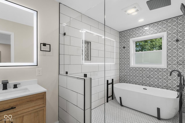 6530 W US Highway 50, North Vernon, IN 47265 - bathroom featuring vanity, a freestanding tub, tiled shower, and tile patterned floors