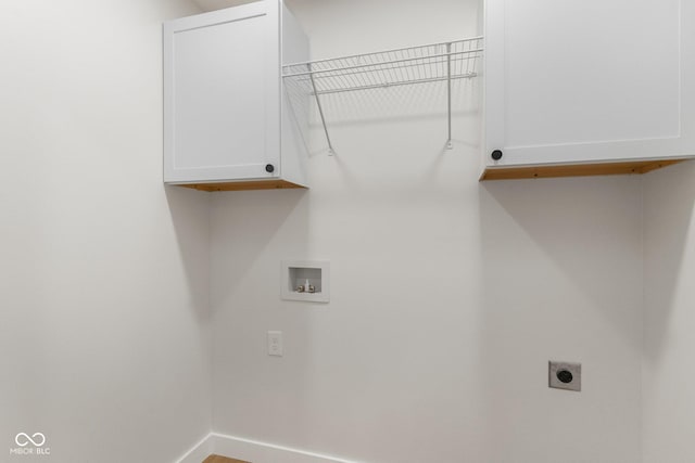 6530 W US Highway 50, North Vernon, IN 47265 - laundry area with cabinet space, hookup for a washing machine, hookup for an electric dryer, and wood finished floors