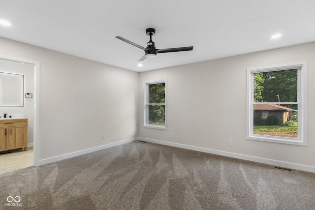 6530 W US Highway 50, North Vernon, IN 47265 - unfurnished room with a ceiling fan, light carpet, recessed lighting, and healthy amount of natural light