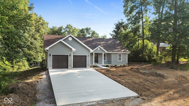 6530 W US Highway 50, North Vernon, IN 47265 - single story home featuring driveway, a garage, and covered porch