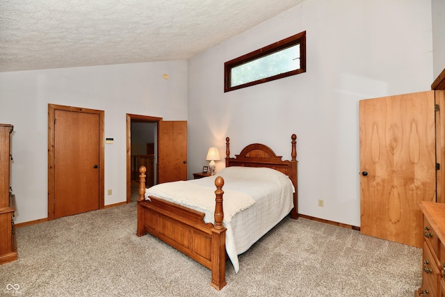 5202 Hill Valley Dr, Pittsboro, IN 46167 - bedroom with a textured ceiling, light colored carpet, and high vaulted ceiling