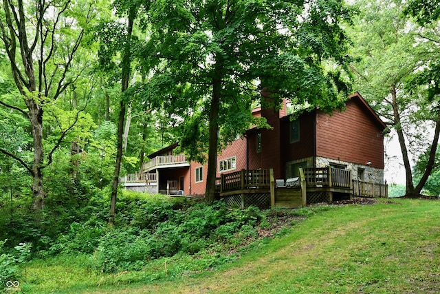 5202 Hill Valley Dr, Pittsboro, IN 46167 - rear view of house with a deck and a lawn