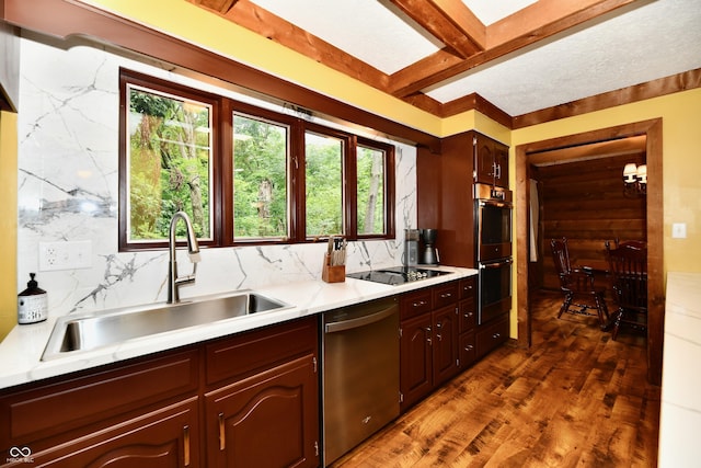 5202 Hill Valley Dr, Pittsboro, IN 46167 - kitchen featuring appliances with stainless steel finishes, light countertops, healthy amount of natural light, tasteful backsplash, and beam ceiling