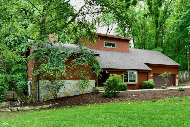 5202 Hill Valley Dr, Pittsboro, IN 46167 - view of front facade featuring roof with shingles, a front yard, a garage, and stone siding