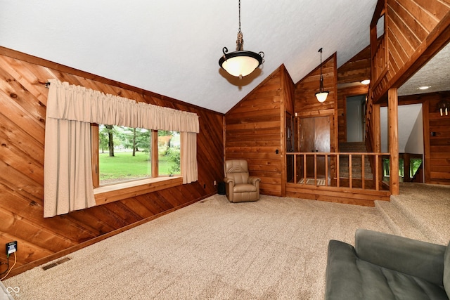 5202 Hill Valley Dr, Pittsboro, IN 46167 - unfurnished living room with wood walls, vaulted ceiling, and carpet