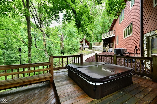 5202 Hill Valley Dr, Pittsboro, IN 46167 - wooden terrace featuring a covered hot tub and a wooded view
