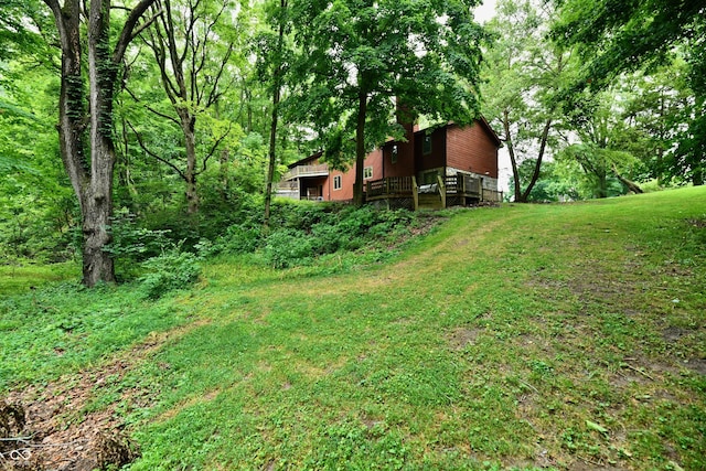 5202 Hill Valley Dr, Pittsboro, IN 46167 - view of green lawn with a wooden deck