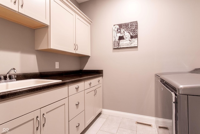 1434 Shootingstar Way, West Lafayette, IN 47906 - washroom with cabinet space, separate washer and dryer, and light tile patterned floors