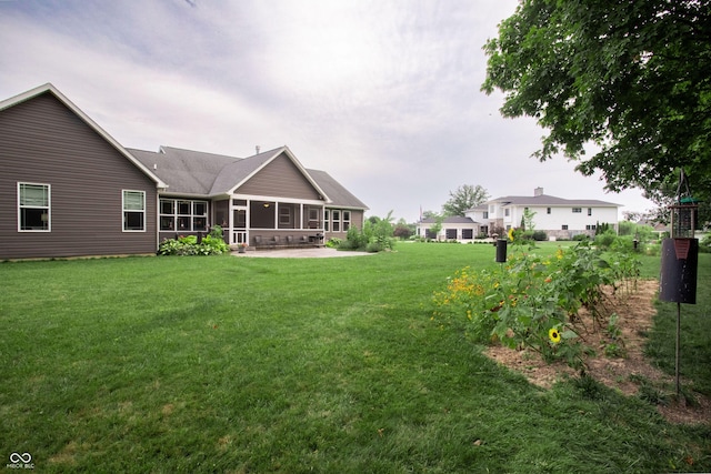 1434 Shootingstar Way, West Lafayette, IN 47906 - back of property with a sunroom and a lawn