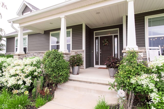1434 Shootingstar Way, West Lafayette, IN 47906 - view of exterior entry with stone siding and covered porch