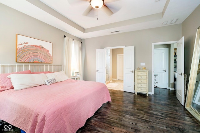 801 Oaklawn Dr, Westfield, IN 46074 - bedroom with dark wood-type flooring, a raised ceiling, and ceiling fan