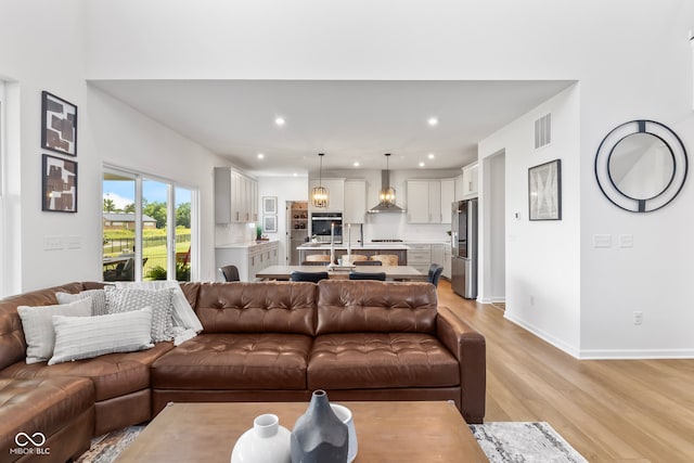 13644 Haven Cove Ln, Fishers, IN 46055 - living area with light wood finished floors and recessed lighting