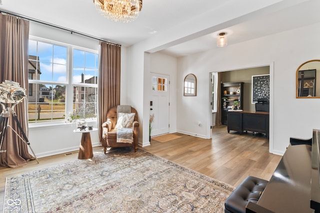 13644 Haven Cove Ln, Fishers, IN 46055 - entrance foyer with wood finished floors and a chandelier