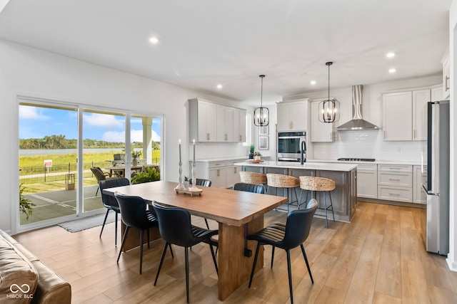 13644 Haven Cove Ln, Fishers, IN 46055 - dining room with recessed lighting, a chandelier, and light wood-type flooring