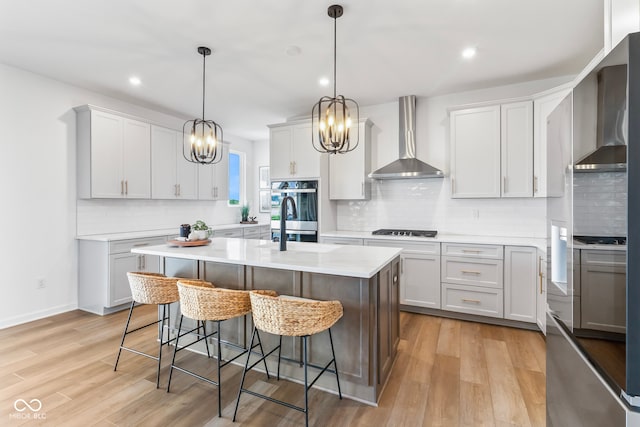 13644 Haven Cove Ln, Fishers, IN 46055 - kitchen featuring wall chimney exhaust hood, stainless steel double oven, light countertops, decorative backsplash, and recessed lighting
