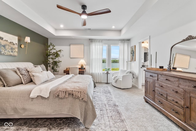 13644 Haven Cove Ln, Fishers, IN 46055 - bedroom with a raised ceiling, light colored carpet, ceiling fan, ensuite bath, and recessed lighting