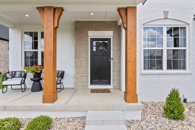 13644 Haven Cove Ln, Fishers, IN 46055 - view of exterior entry with a porch and brick siding