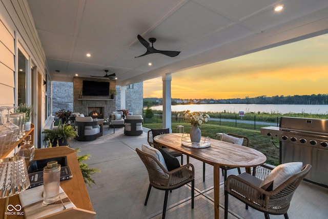 13644 Haven Cove Ln, Fishers, IN 46055 - view of patio / terrace featuring grilling area, outdoor dining area, a ceiling fan, and an outdoor living space with a fireplace