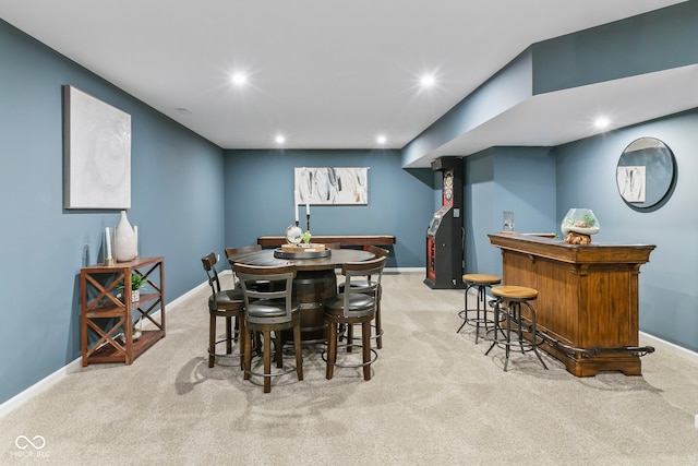 13644 Haven Cove Ln, Fishers, IN 46055 - dining area with a bar, light colored carpet, and recessed lighting