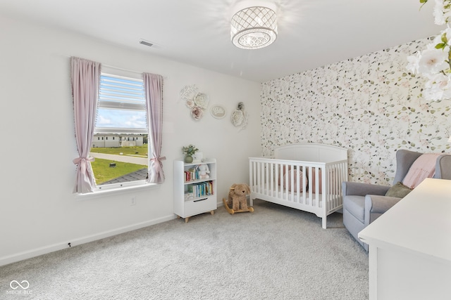 13644 Haven Cove Ln, Fishers, IN 46055 - bedroom with carpet flooring, a crib, and an accent wall