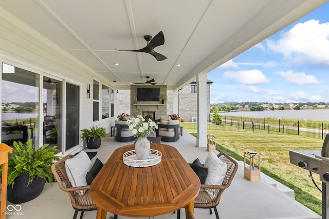 13644 Haven Cove Ln, Fishers, IN 46055 - view of patio featuring an outdoor stone fireplace, ceiling fan, and grilling area