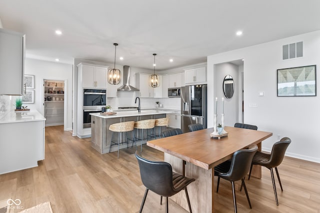 13644 Haven Cove Ln, Fishers, IN 46055 - dining area with recessed lighting, light wood-style floors, and a chandelier