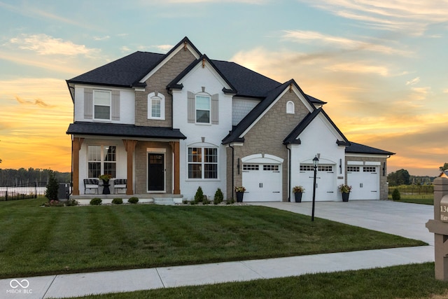 13644 Haven Cove Ln, Fishers, IN 46055 - view of front of property with a porch, stone siding, and driveway