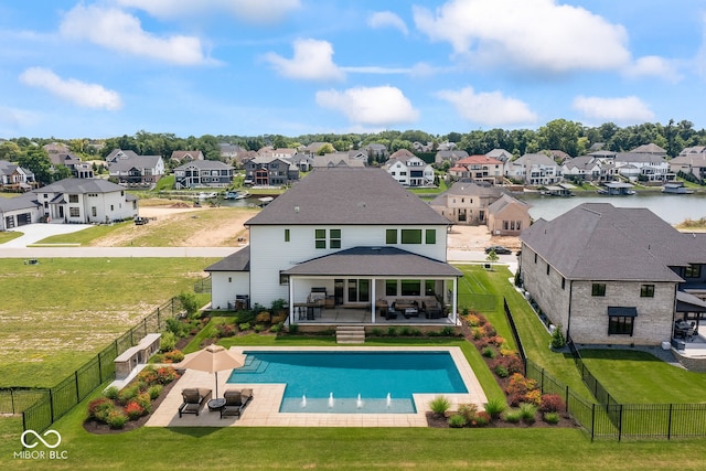13644 Haven Cove Ln, Fishers, IN 46055 - back of house featuring a residential view, a fenced backyard, a patio area, and a shingled roof