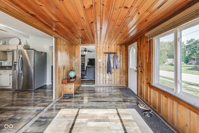 307 E Walnut St, Lebanon, IN 46052 - corridor featuring healthy amount of natural light, wood finished floors, wood walls, and wood ceiling
