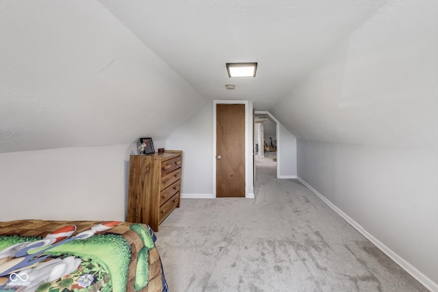 307 E Walnut St, Lebanon, IN 46052 - bedroom featuring carpet floors and vaulted ceiling