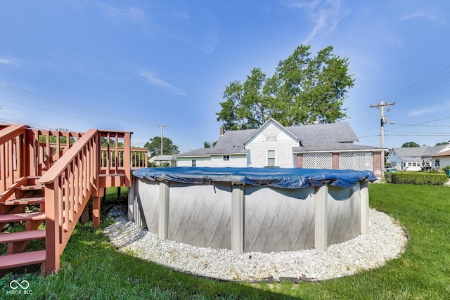 307 E Walnut St, Lebanon, IN 46052 - view of pool with a lawn, a deck, a covered pool, and stairs