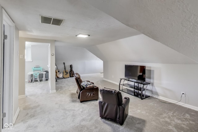 307 E Walnut St, Lebanon, IN 46052 - sitting room featuring a textured ceiling, carpet, and vaulted ceiling