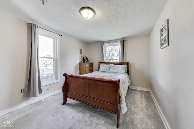 307 E Walnut St, Lebanon, IN 46052 - carpeted bedroom featuring a textured ceiling and baseboards