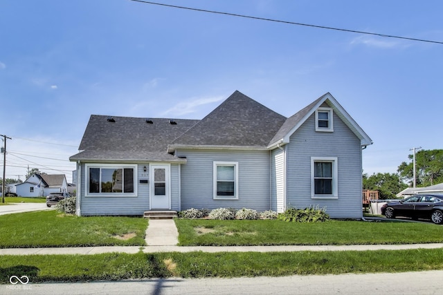 307 E Walnut St, Lebanon, IN 46052 - view of front of property with a front lawn and a shingled roof