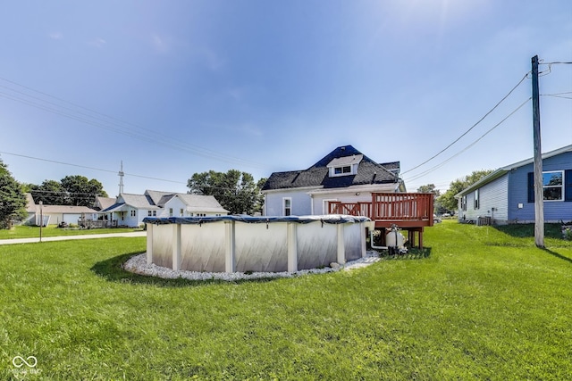 307 E Walnut St, Lebanon, IN 46052 - back of house featuring a lawn, a covered pool, and a deck