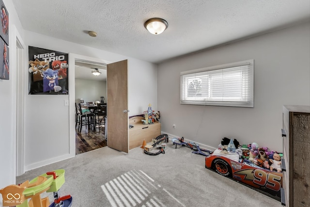 307 E Walnut St, Lebanon, IN 46052 - game room with carpet floors and a textured ceiling