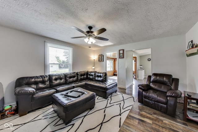 307 E Walnut St, Lebanon, IN 46052 - living room featuring wood finished floors, ceiling fan, and a textured ceiling