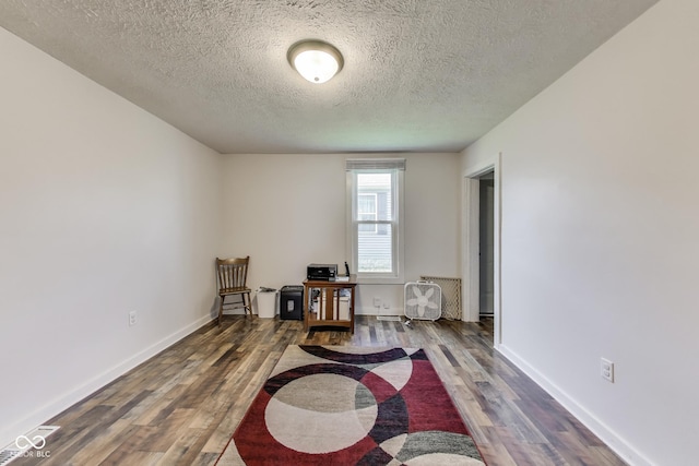 307 E Walnut St, Lebanon, IN 46052 - unfurnished room with a textured ceiling and wood finished floors