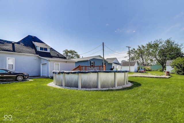 307 E Walnut St, Lebanon, IN 46052 - back of house with a yard and roof with shingles