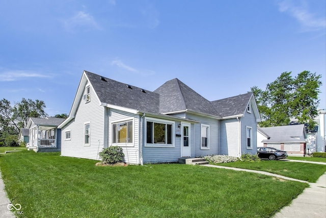 307 E Walnut St, Lebanon, IN 46052 - view of front of property featuring a front yard and roof with shingles