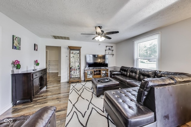 307 E Walnut St, Lebanon, IN 46052 - living room with wood finished floors, ceiling fan, and a textured ceiling