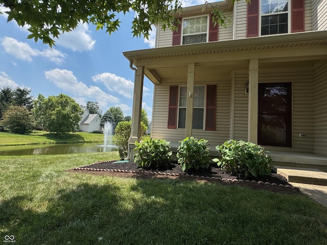14520 Brackney Ln, Carmel, IN 46032 - view of side of property featuring a water view, a porch, and a lawn