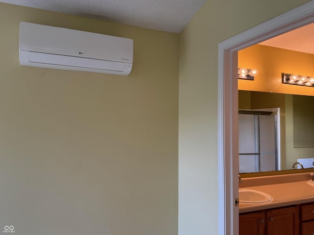 14520 Brackney Ln, Carmel, IN 46032 - full bath featuring an AC wall unit, vanity, a shower stall, and a textured ceiling