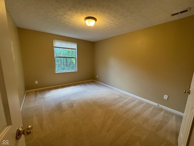 14520 Brackney Ln, Carmel, IN 46032 - empty room with carpet floors and a textured ceiling