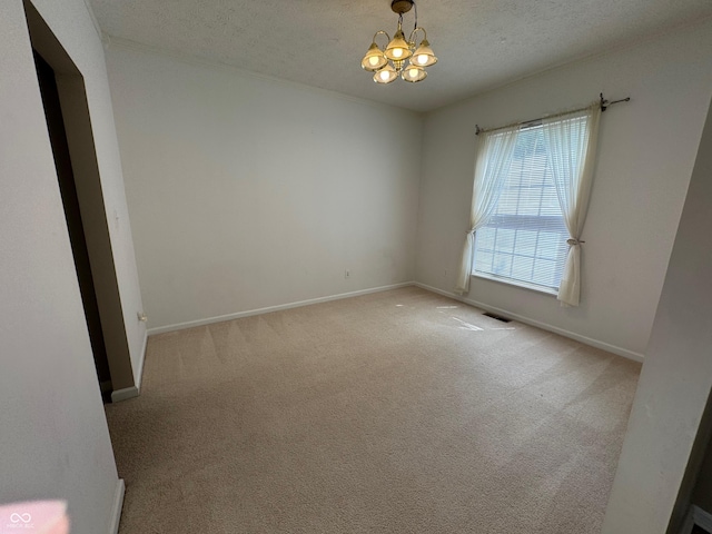 14520 Brackney Ln, Carmel, IN 46032 - unfurnished room featuring a chandelier, light carpet, and a textured ceiling