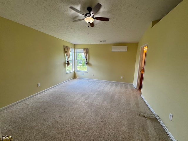 14520 Brackney Ln, Carmel, IN 46032 - spare room with ceiling fan, a textured ceiling, carpet flooring, and a wall mounted AC